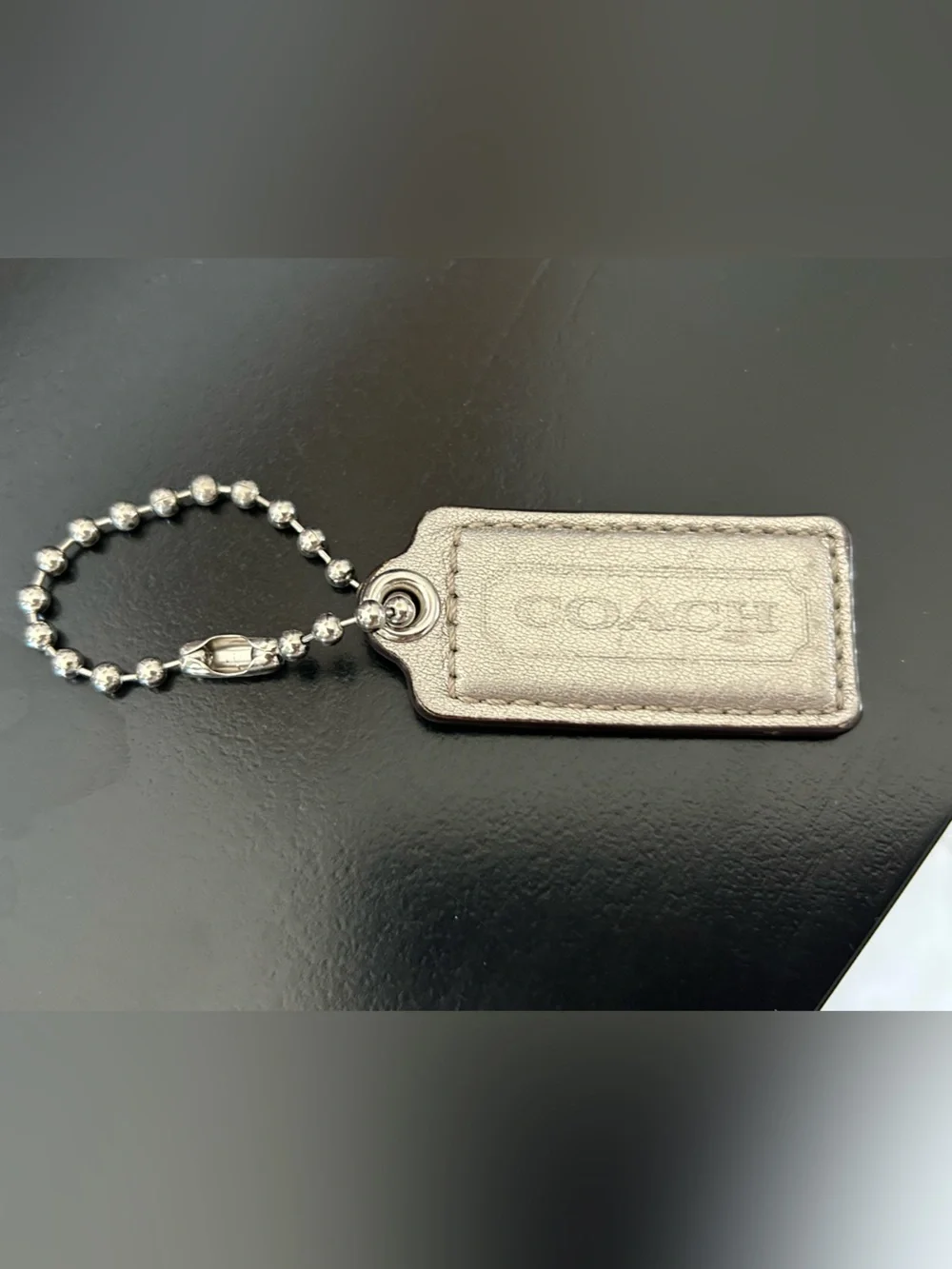 COACH Metallic Gold Leather Hang Tag